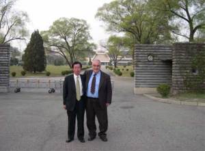 In front of the State Guest House in Pyongyang with one of the North Korean hosts and Secretary General Paolo Cotta-Ramusino